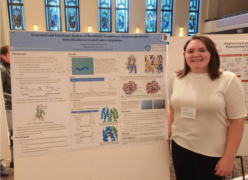 Morgan Buchman presenting her poster at the Midwest Enzyme Chemistry Conference (2022)